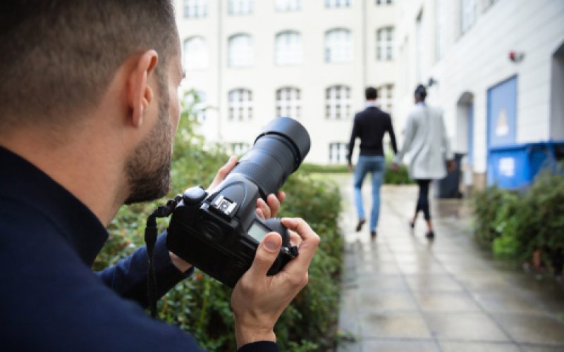 Young,Man,Paparazzi,Photographer,Capturing,A,Photo,Suspiciously,Of,Couple